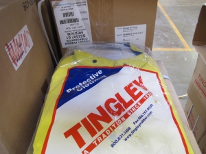 LOT TO INCLUDE: LARGE QUANTITY OF RAIN COATS, RAIN PANTS, AND COVERALLS.. LOADING & HANDLING FEE $15-4216